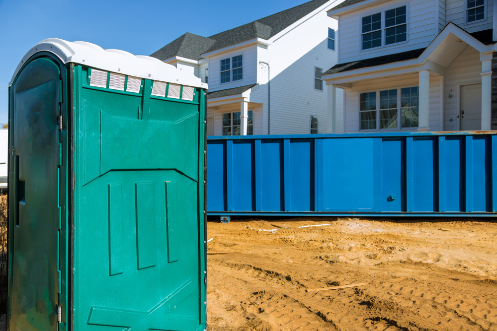 Portable,bio,toilet,cabins,at,the,construction,on,removal,of