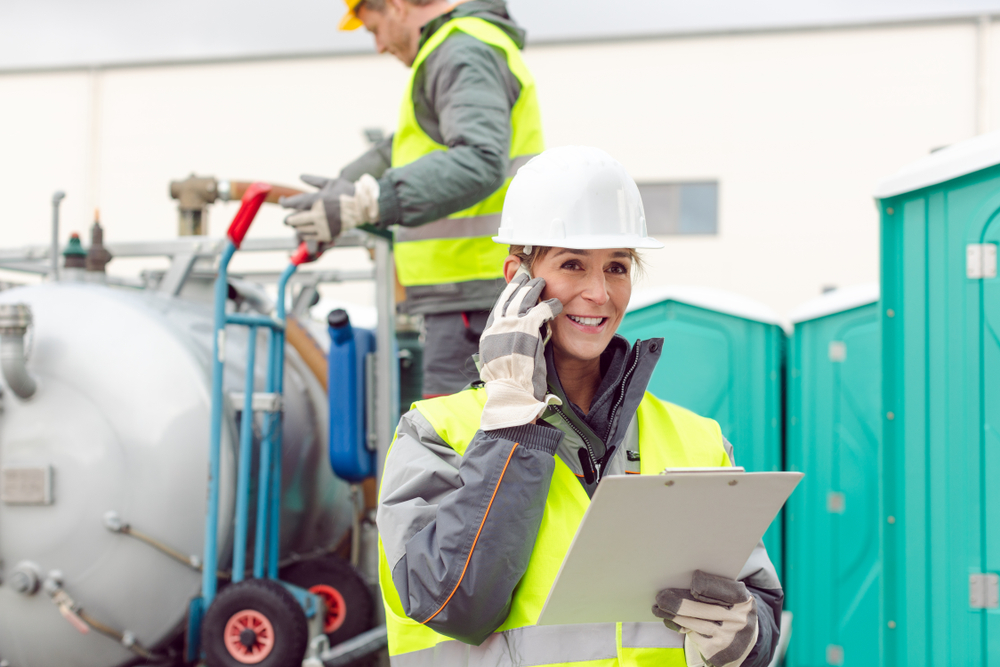 Workers,taking,care,of,a,delivery,of,mobile,rental,toilets